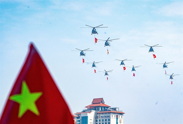 [PHOTOS] Military helicopters, fighter jets in rehearsal flypast over central Hà Nội- Ảnh 6.